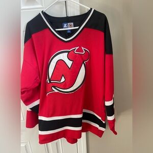 New Jersey Devils vintage 90s starter brand Hockey Jersey. Size large